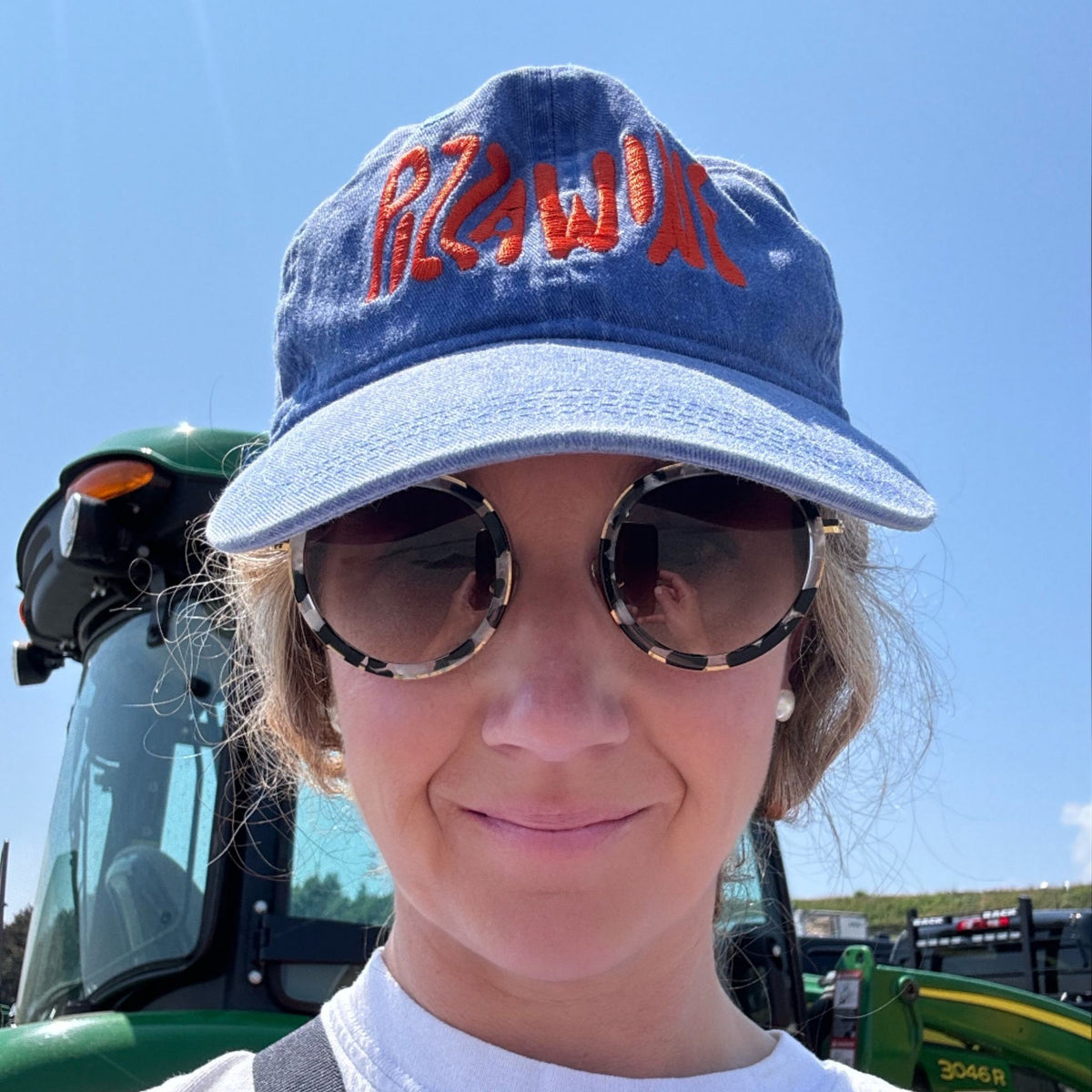 Pizza Wine dad hat in washed denim with orange stitched logo