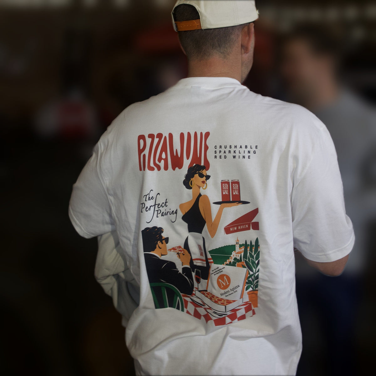 Back of the Modern x PW tee with the pizza-night illustration